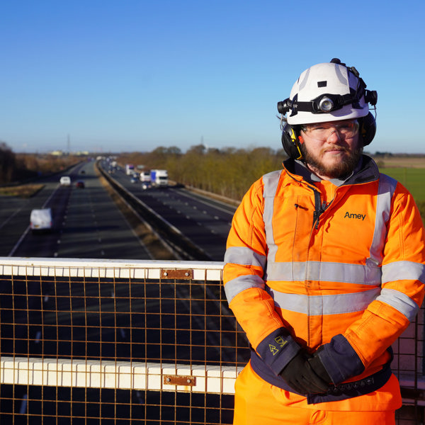 Apprentice standing a bridge 