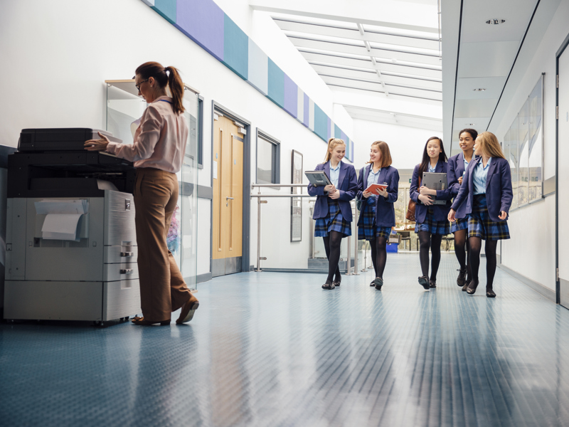 School children walking down a corridor